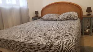 A bed or beds in a room at Appartement F4 proche de DisneyLand Paris