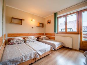 Postel nebo postele na pokoji v ubytování Dom Wczasowy Stanislawa