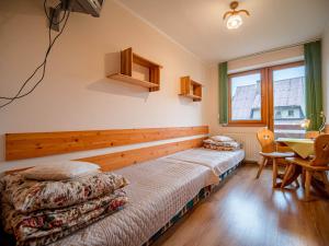 Postel nebo postele na pokoji v ubytování Dom Wczasowy Stanislawa