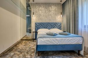 Postel nebo postele na pokoji v ubytování Hotel & Spa Biały Dom