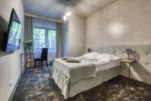 Postel nebo postele na pokoji v ubytování Hotel & Spa Biały Dom