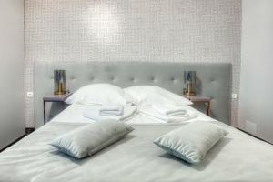 Postel nebo postele na pokoji v ubytování Hotel & Spa Biały Dom