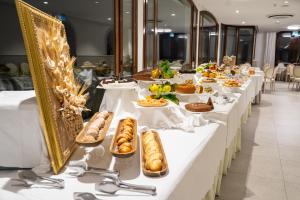 a buffet line with plates of food on tables at San Lorenzo - Boutique Hotel & SPA in Lettere