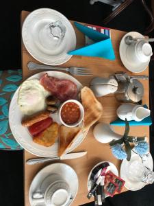 a table with a plate of breakfast food on it at Westbourne House in Blackpool