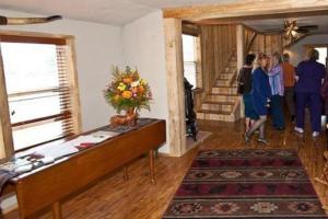 a group of people standing in a living room at Trail City Bed & Breakfast in Coolidge