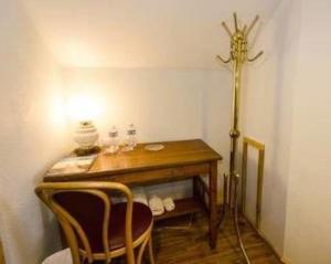 a room with a table and two chairs and a lamp at Trail City Bed & Breakfast in Coolidge