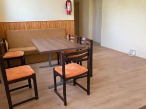 a table and chairs in a room with a couch at Éden Fonyód in Fonyód +24 photos