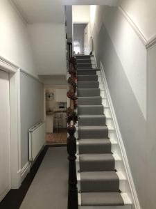 a stairway leading up to the second floor of a house at Sapphire House Sasco Apartments in Blackpool