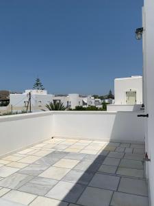 a view from the balcony of a white building at Rodia Studios & Apartments in Parikia