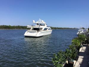 a white boat is docked in the water at Bimini Motel in Hollywood