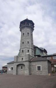a stone lighthouse on top of a building at Ferienwohnung Häckel in Kurort Oberwiesenthal