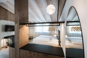 Posteľ alebo postele v izbe v ubytovaní Hotel Ciasa Tamá