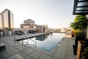 a swimming pool on the roof of a building at The Windsor Suites Philadelphia in Philadelphia