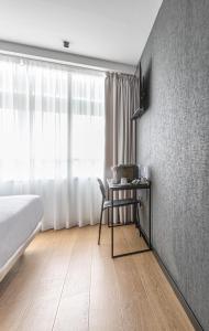 Postel nebo postele na pokoji v ubytování Hotel Forum Ceao