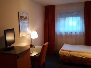 TV a/nebo společenská místnost v ubytování City Hotel Stuttgart