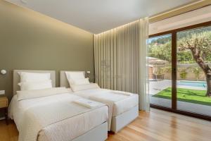 Giường trong phòng chung tại Quinta do Aido - WineTourism