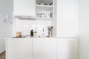 A kitchen or kitchenette at Sugar Beach Boutique Studio