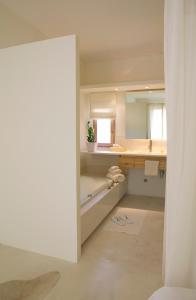 a bathroom with a sink and a mirror at Son Gener Hotel Spa in Son Servera