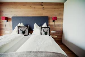 Łóżko lub łóżka w pokoju w obiekcie Hotel Aberseehof