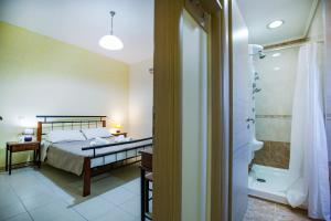 A bed or beds in a room at Vasso Apartments 3