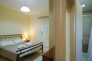 A bed or beds in a room at Vasso Apartments 3