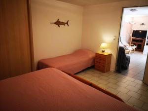 Postel nebo postele na pokoji v ubytování Résidence Miro, gîtes climatisés avec piscine et tennis