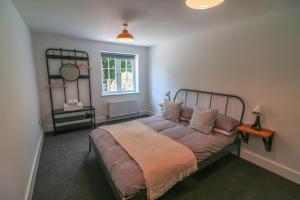 En eller flere senge i et værelse på The wood shed