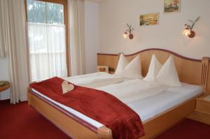 Posteľ alebo postele v izbe v ubytovaní Landhaus Montana
