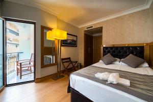 Postel nebo postele na pokoji v ubytování Levent Hotel Istanbul + 37 fotografií