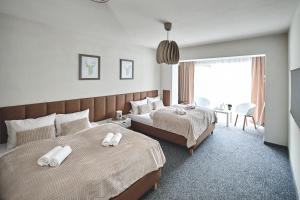 Кровать или кровати в номере Apart Nova - pokoje gościnne