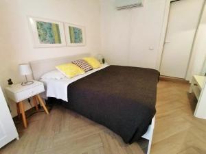 Postel nebo postele na pokoji v ubytování Le Nuvole di Ortigia