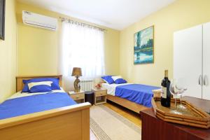 Postel nebo postele na pokoji v ubytování Villa Tower Gardos