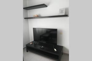 TV a/nebo společenská místnost v ubytování Franja de Mar - Duplex amplio y luminoso