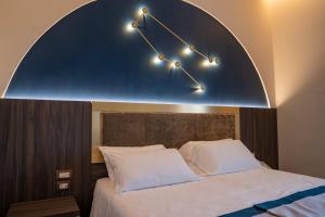A bed or beds in a room at San Lorenzo - Boutique Hotel & SPA