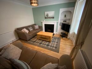 an overhead view of a living room with a couch and a tv at No. 20 in Inverness