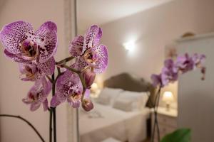 A bed or beds in a room at Vico d'Ercole