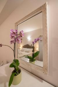 A bed or beds in a room at Vico d'Ercole