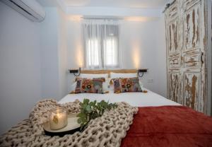 מיטה או מיטות בחדר ב-Casa Flor del Naranjo