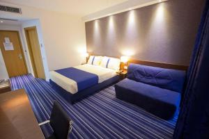 Posteľ alebo postele v izbe v ubytovaní GP Hotel