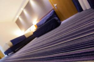 Posteľ alebo postele v izbe v ubytovaní GP Hotel