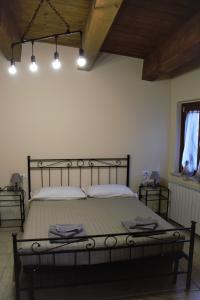 Posteľ alebo postele v izbe v ubytovaní B&B La Vecchia Osteria