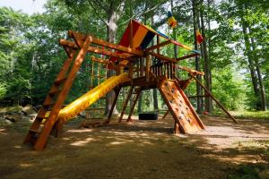 a playground with a slide in a park at InnSeason Resorts The Falls at Ogunquit in Ogunquit