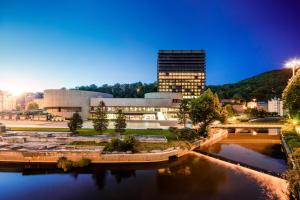 a campus with a building in the background at Hotel Thermal in Karlovy Vary