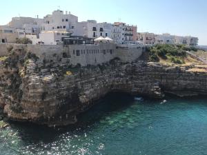 an aerial view of a city and the ocean at Nunuccio - Locazione Turistica in Polignano a Mare