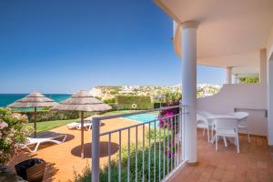 a balcony with a view of the ocean at Clube Porto Mos - Sunplace Hotels & Beach Resort in Lagos