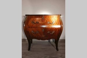 a wooden dresser sitting in a room at Nad Strumykiem in Mszana Dolna +15 photos