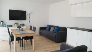 TV a/nebo společenská místnost v ubytování Morskie Wzgórze Apartamenty