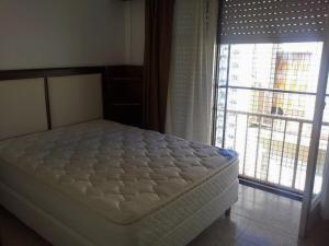 Una cama o camas en una habitación de Apartamento Miramar Calle 21