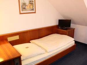 Postel nebo postele na pokoji v ubytování City Hotel Stuttgart