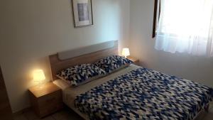 Posteľ alebo postele v izbe v ubytovaní Apartmani Mia
